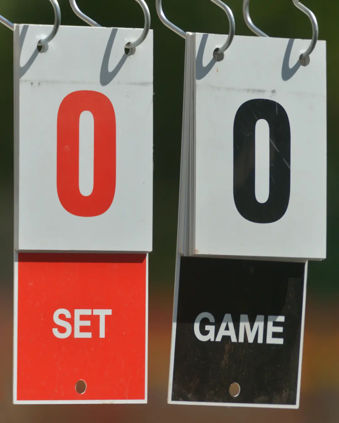 manual tennis scoreboard with zero sets and zero games