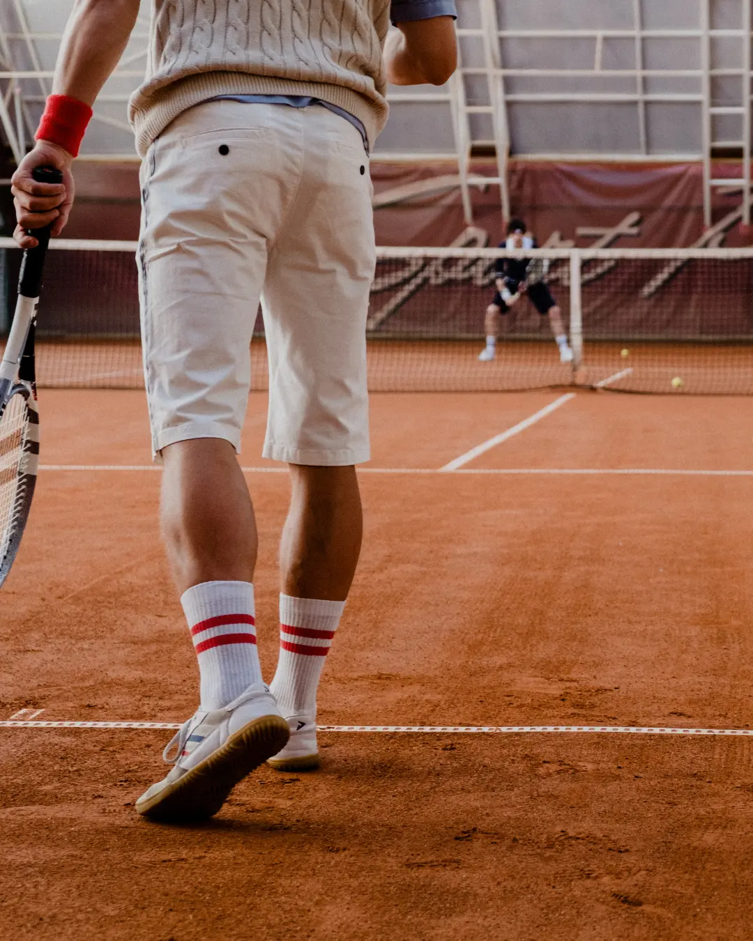 tennis player ready to serve on clay court